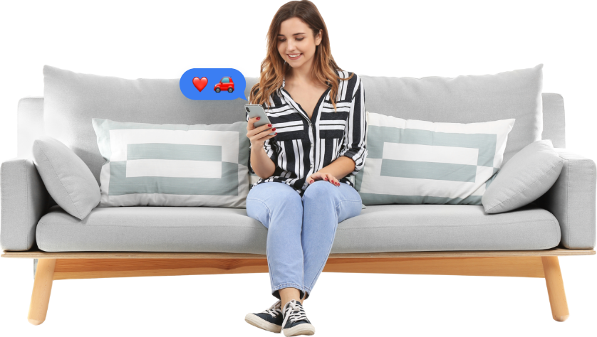 woman on a sofa looking at phone