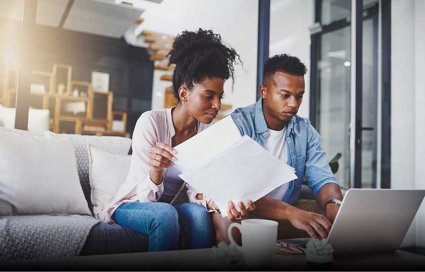 Couple reviewing financial documents together